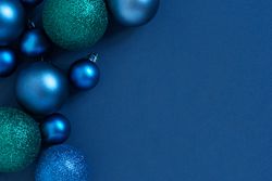 Blue holiday baubles with copy space