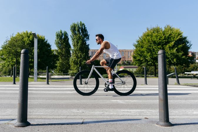 Man riding bicycle on city roadway