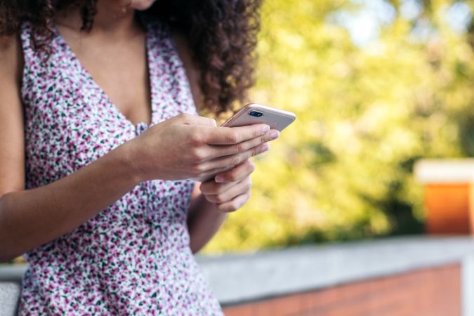 Close-up of an unrecognizable woman using a smartphone