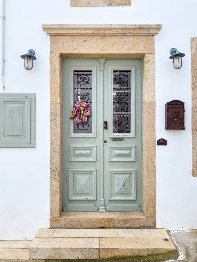 Patmian door with wreath of dried flowers