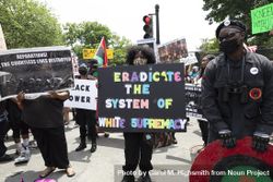 Group of protesters holding signs calling for eradicating white supremacy, Washington, D.C. 5QPed0