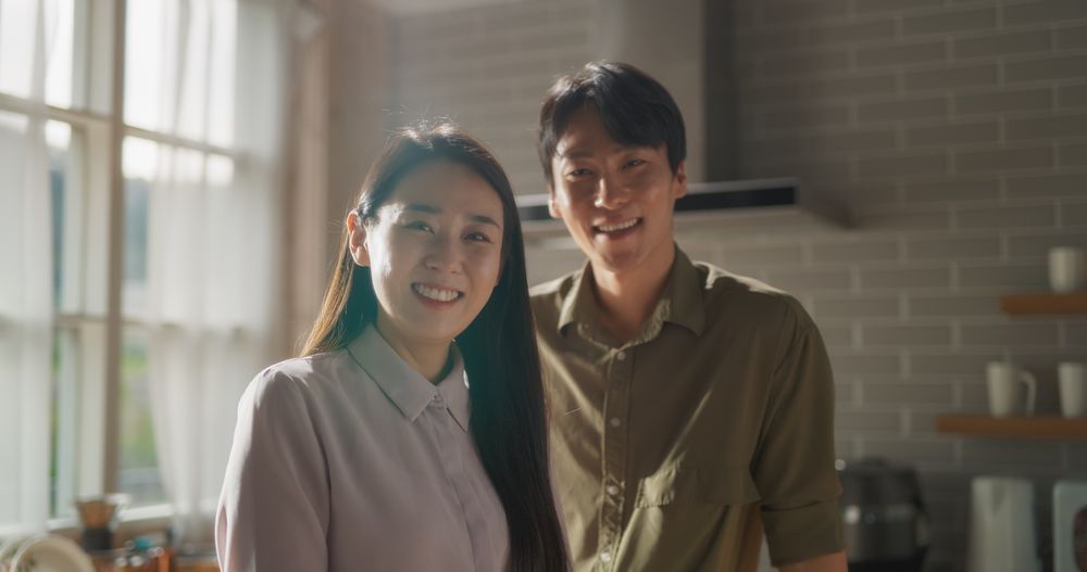 Asian Young Couple Cooking Delicious Food at Home.