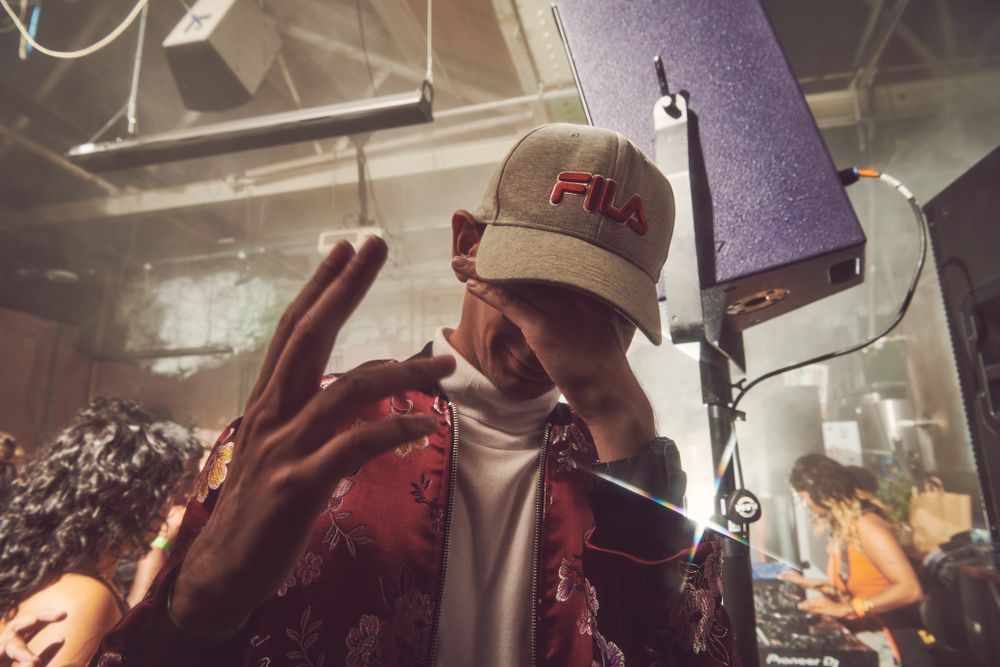 London, England, United Kingdom - Nov 9, 2022: Man in cap with head down at club