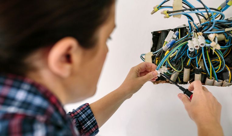 Electrician working on the electrical installation of a house