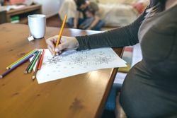 Young woman coloring mandalas