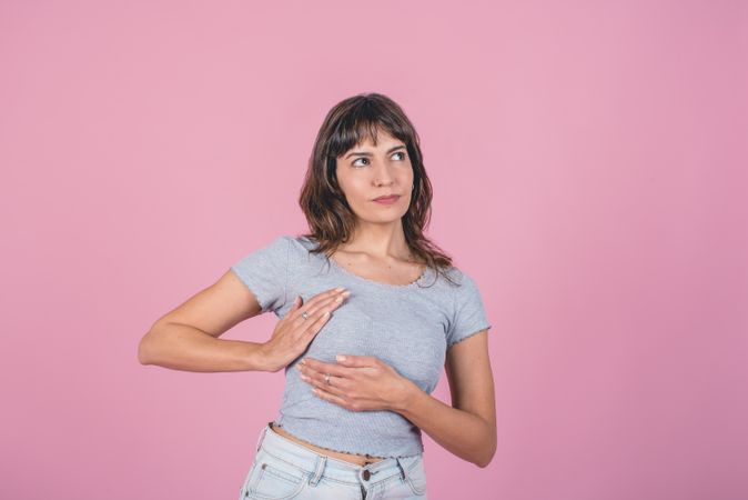 Woman doing a Breast Self-Exam checking up breast changes