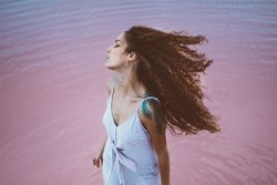 Woman enjoying sea breeze
