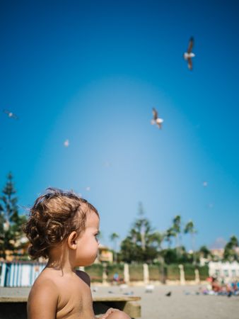 anonymous little girl by the beach