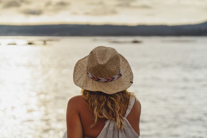 Blond woman resting at seaside