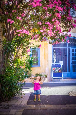 Smiling child standing on street