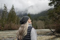 Mature woman soaking up the fresh mountain air
