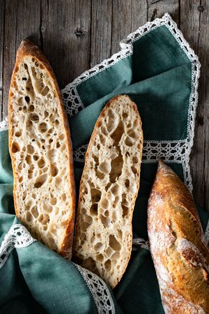 Fresh baguettes on checkered towel