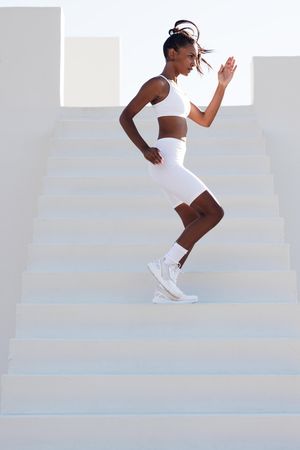 Fit woman working out on stairs