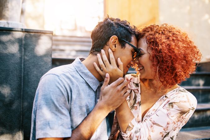 Happy young man and woman in romantic mood expressing love