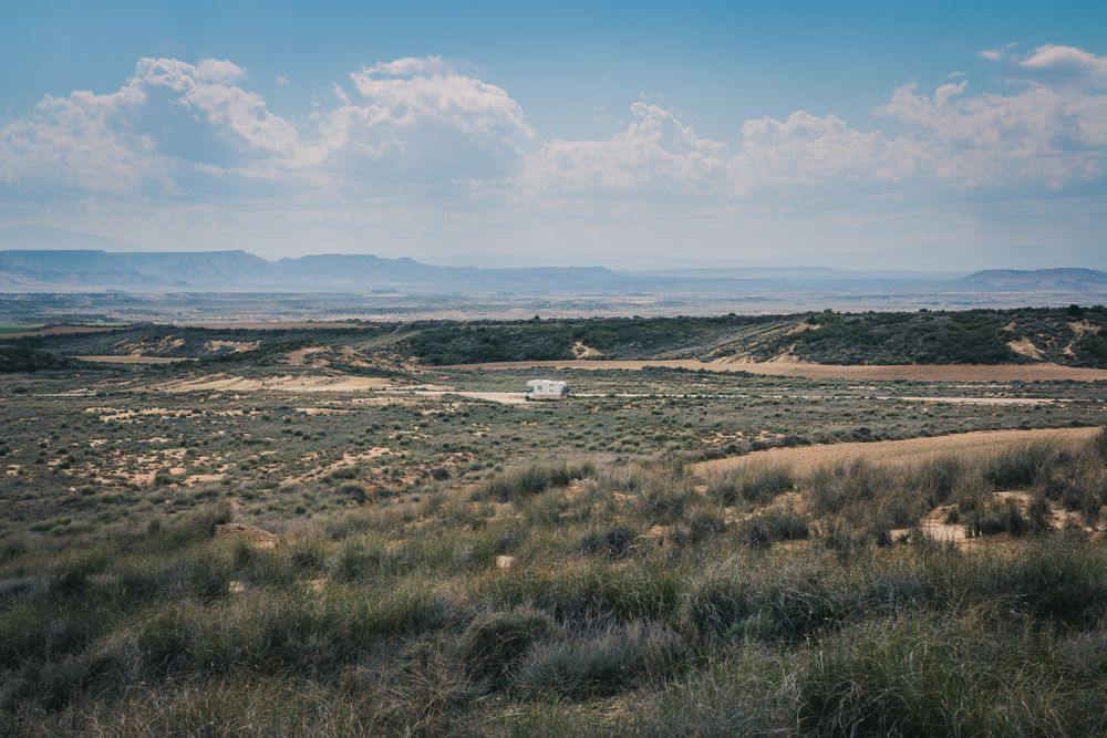 trailer on empty road along desert