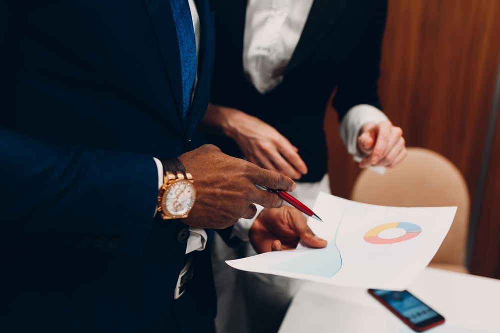 Cropped image of businessman's hand writing on paper