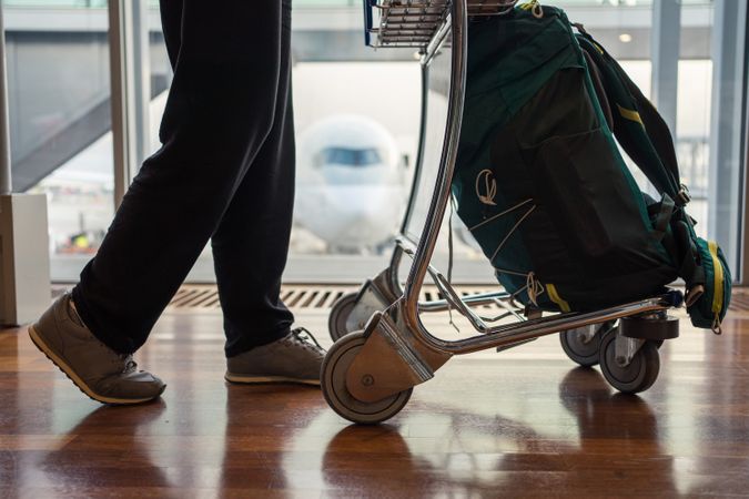 Person legs walking trolley