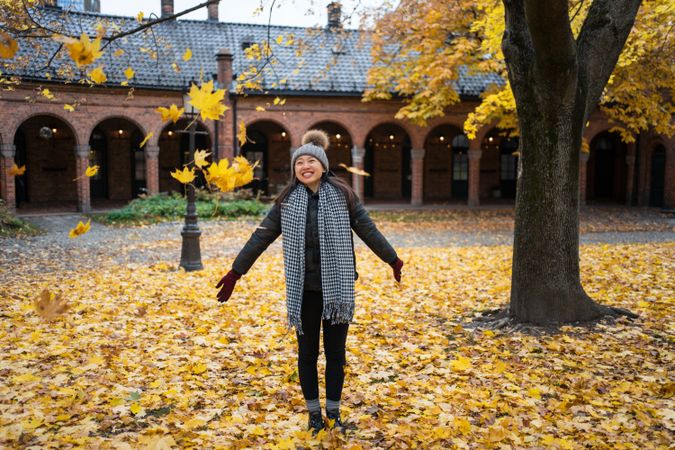Happy female tourist enjoying autumn in Oslo