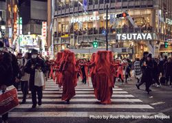 Japan - Tokyo, Shibuya Japan - November 29th, 2019: Red Rebel Brigade with arms outstretched 5oDK14