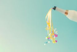 Champagne bottle with party streamers