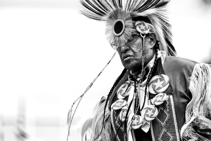 Red Wing, MN, USA - July 8th, 2017: Mature Sioux man in traditional headdress