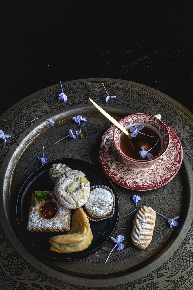 Traditional tea with mint and assorted Arab sweets