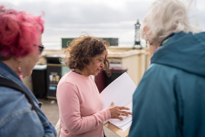 Group of women sharing their work during drawing class