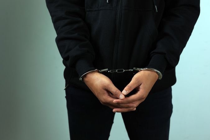 Man in Jacket  in Handcuffs