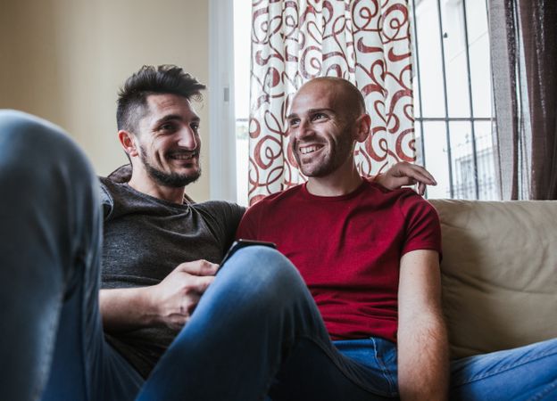 young gay couple at home