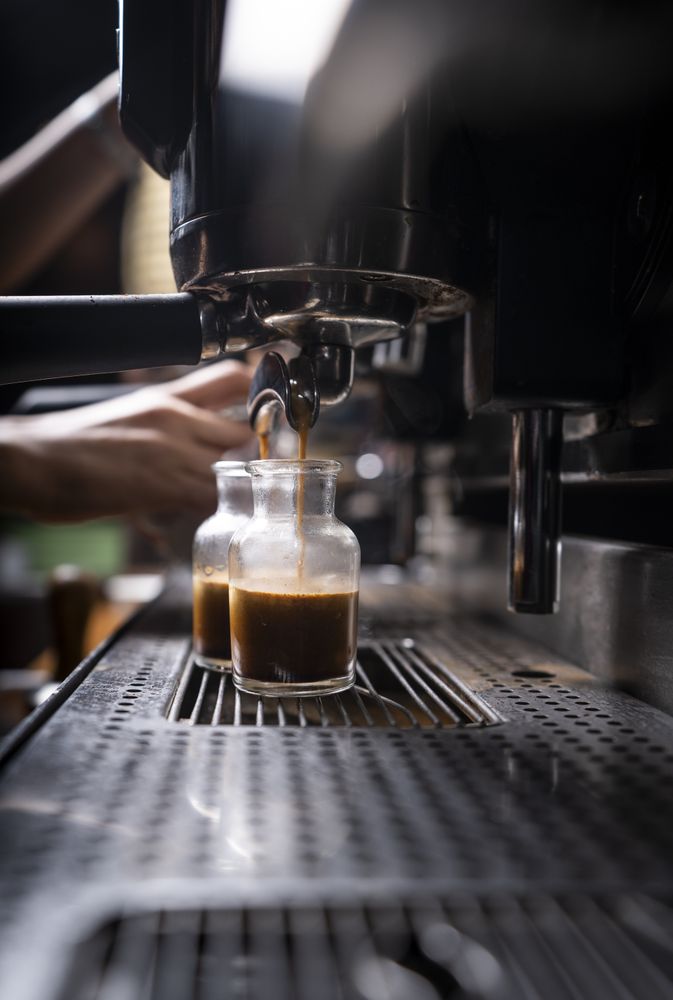Barista using coffee machine