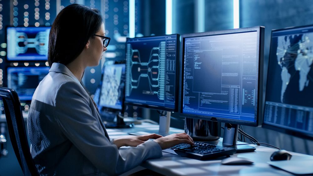 Female System Engineer Controls Operational Proceedings.
