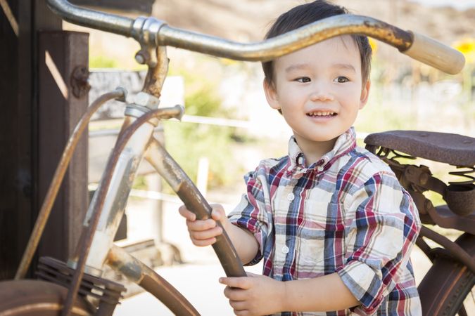 Smiling Young Boy Having Fun on the Bicycle