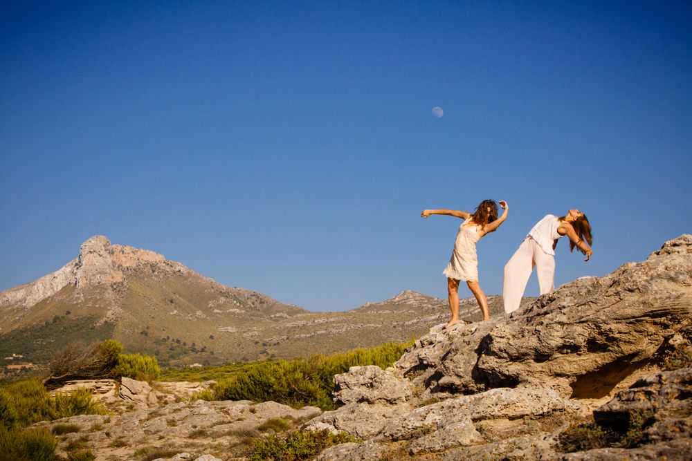 Young women posing on stones