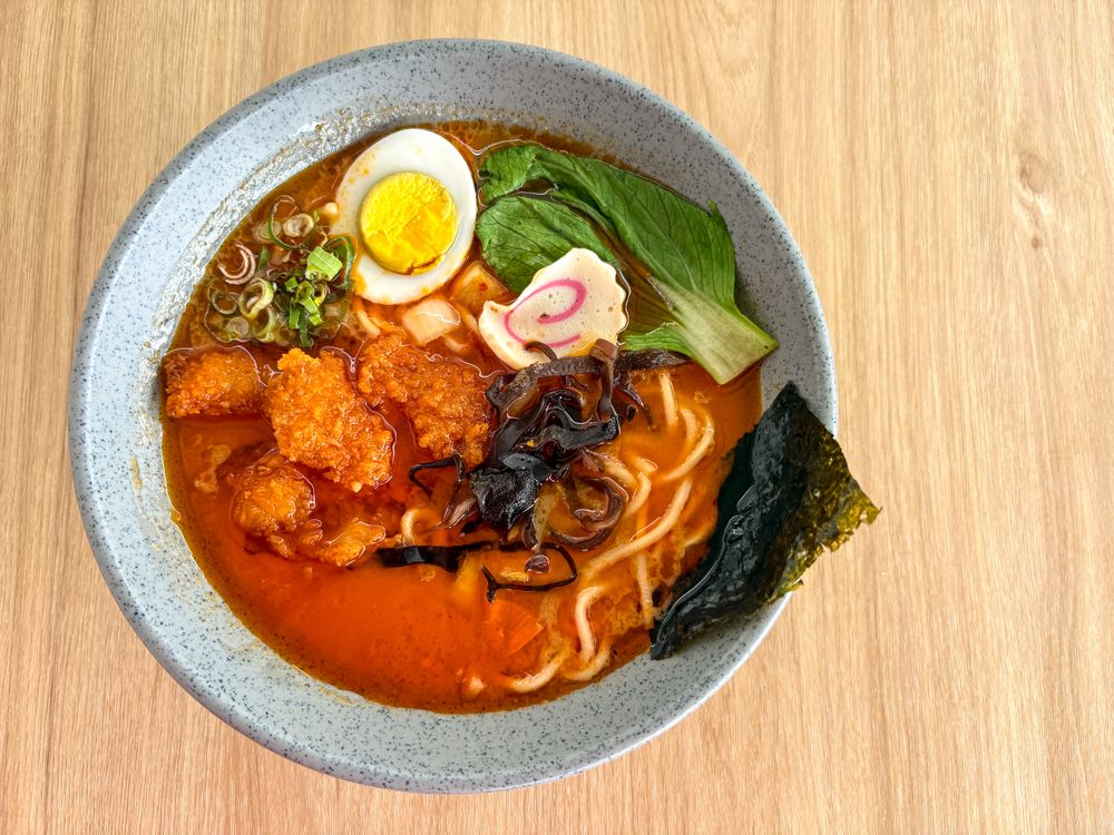 Delicious Bowl of Spicy Ramen Top View on Wooden Table