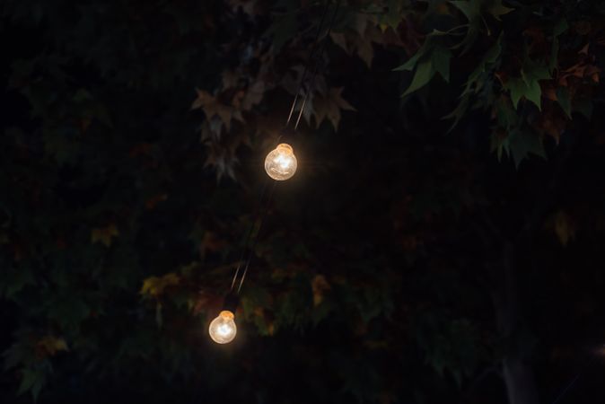Illumination garlands on fairground at night