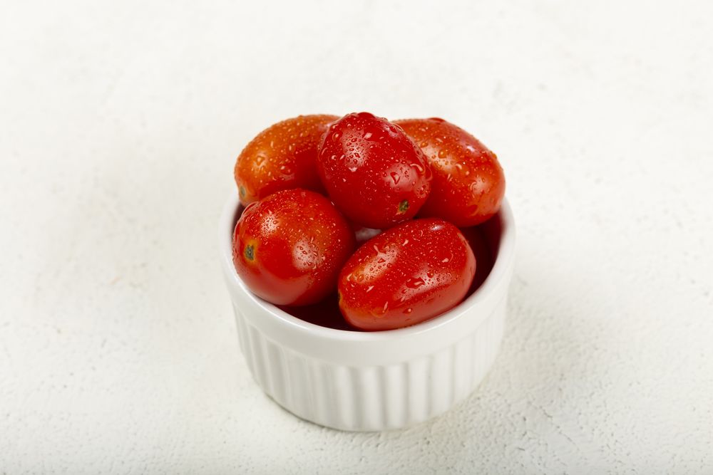 Fresh tomatoes in ramekin