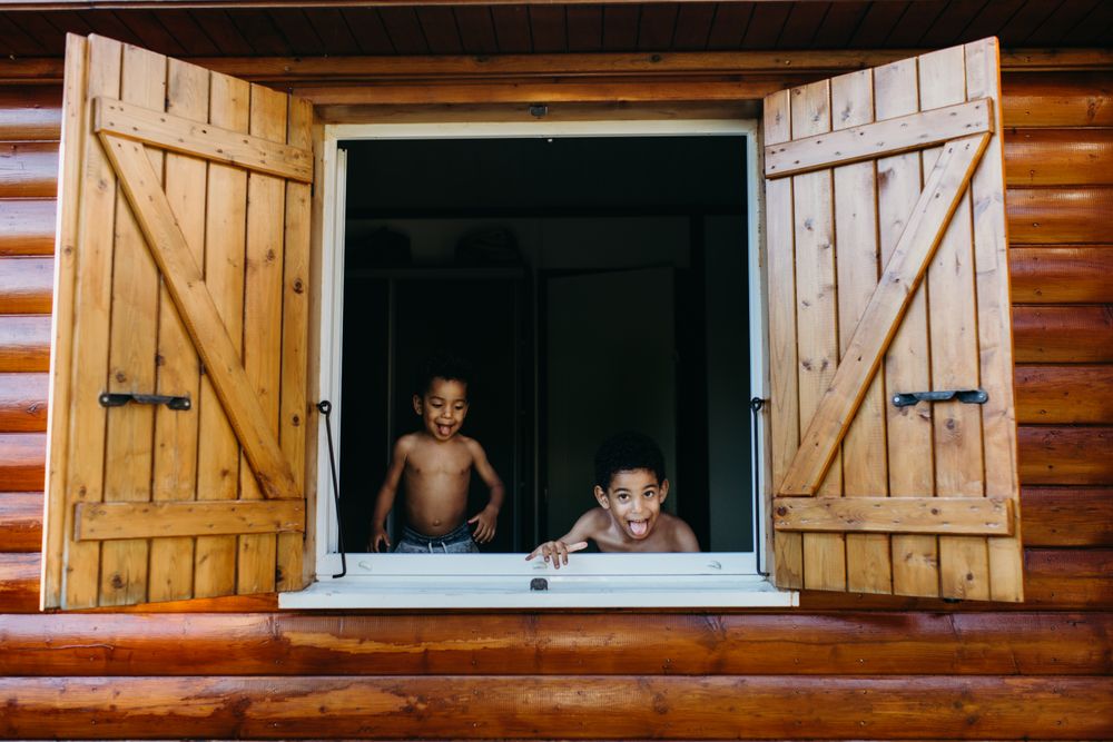 Black boys looking out window