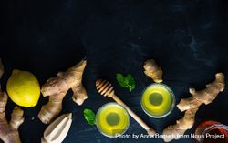 Top view banner of detox drinks with lemon, ginger and mint with copy space 5q6vo4
