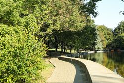 Beautiful city park in bright sunny morning