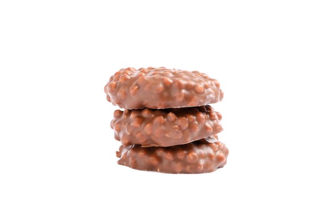 Stack of chocolate cookies with caramel filling isolated on blank background