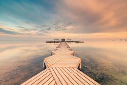 Wooden pier on cloudy evening