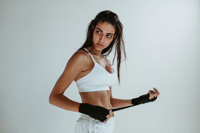 Fitness woman wearing hand wraps for workout