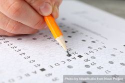 Close up of person pencilling in multiple-choice exam 4ZWROb