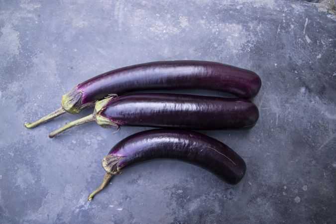 Fresh eggplant on a concrete Floor