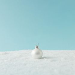 Christmas bauble on snow