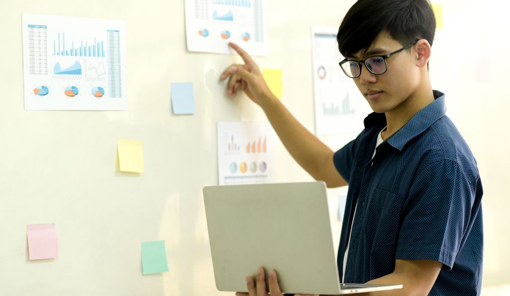 Young man working with laptop for present.
