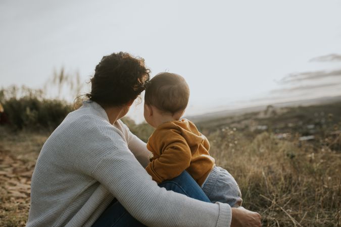 Mother and son sitting outside on an overcast day