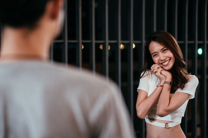 Asian girlfriend waiting for surprise from her boyfriend