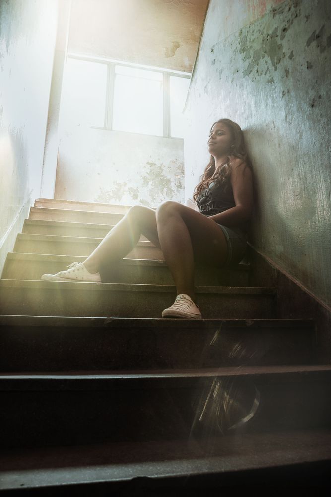 Woman sitting on stairs