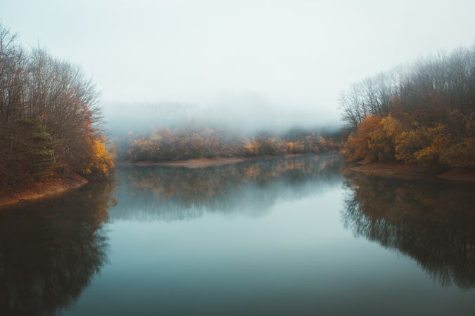 Beautiful tranquil lake in fog